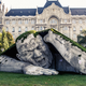 Illustration for article titled Scary giant man crawls out from the ground in shocking outdoor sculpture
